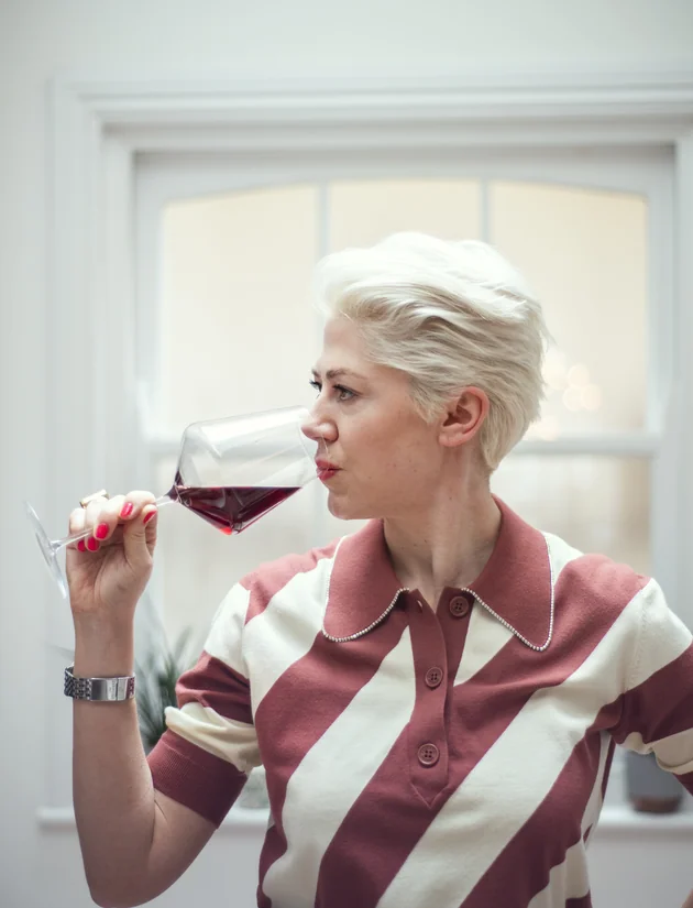 Elizabeth Hawthornthwaite tasting a glass of red wine